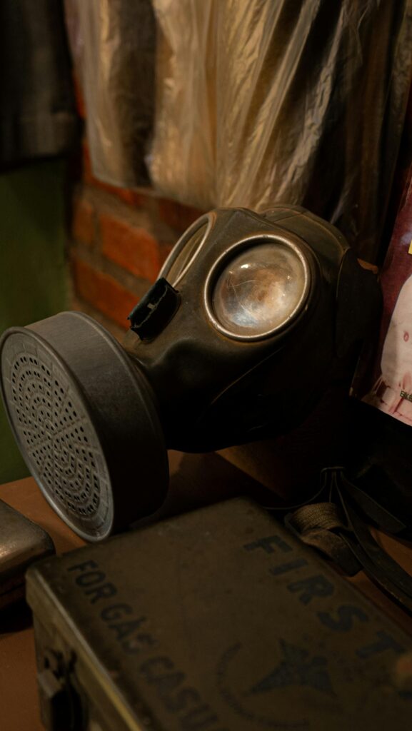 A vintage gas mask in a rustic indoor setting, evoking themes of safety and preparedness.